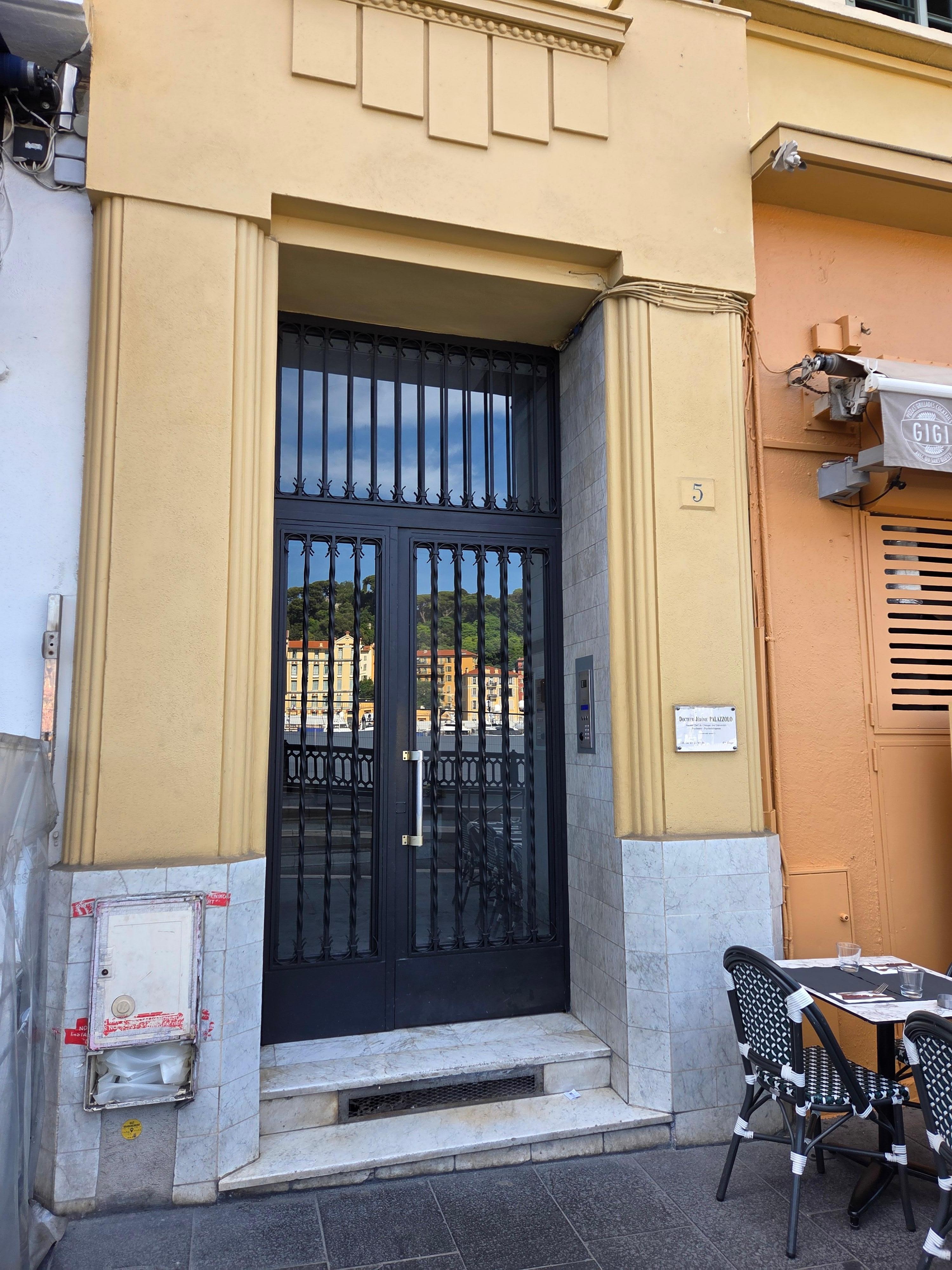 The entry door is located between two of the many sidewalk cafe's.  A convenient key fob unlocks the door.