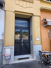 The entry door is located between two of the many sidewalk cafe's. A convenient key fob unlocks the door.