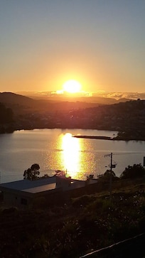 Vista do amanhecer pela varanda do quarto.