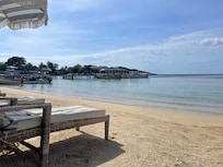Beach lounger. Calm water. Bring a floatie!