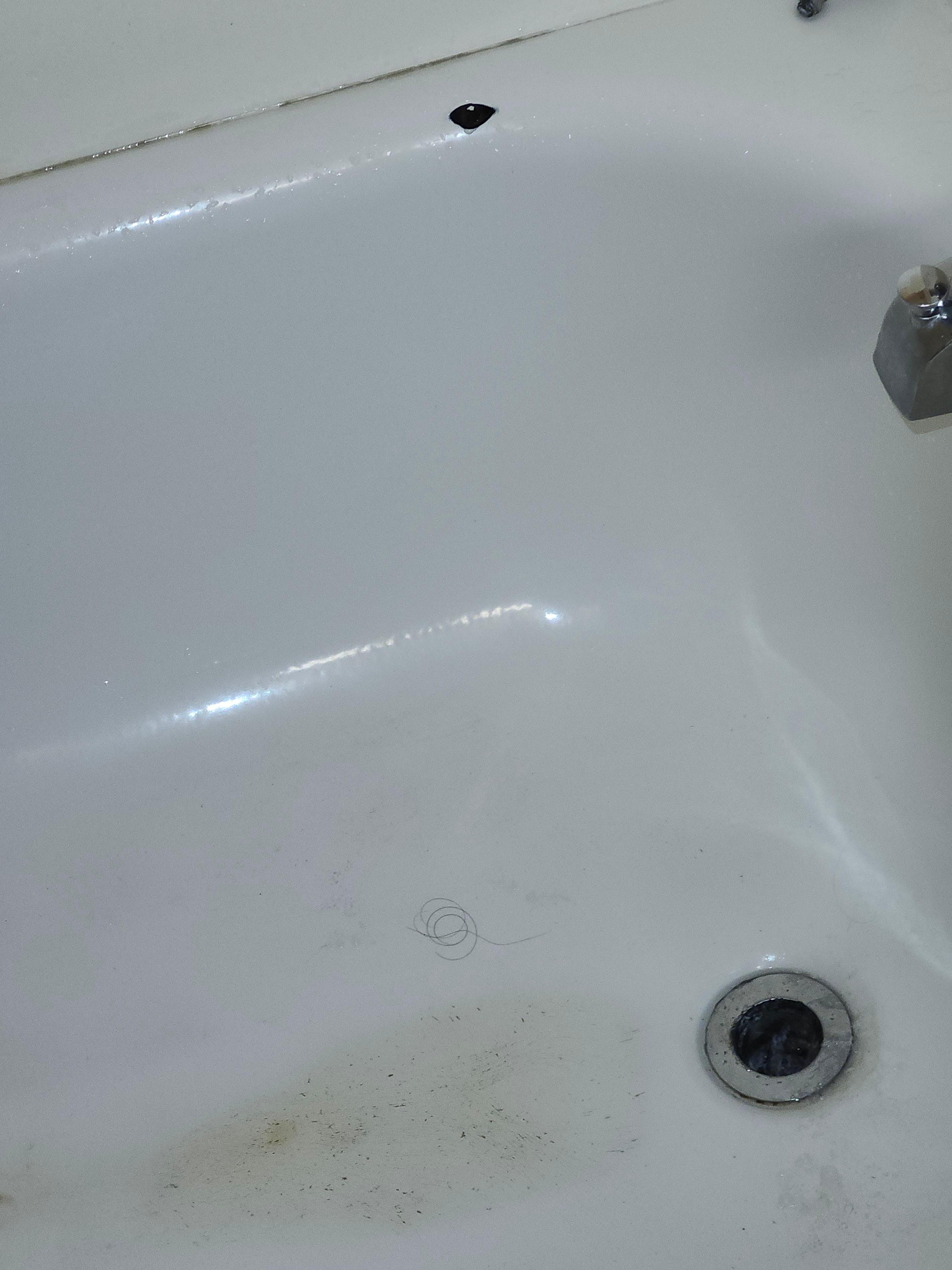 Stained and chipped old bathtub.