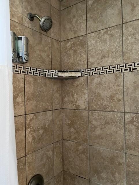 missing tiles in both bathrooms