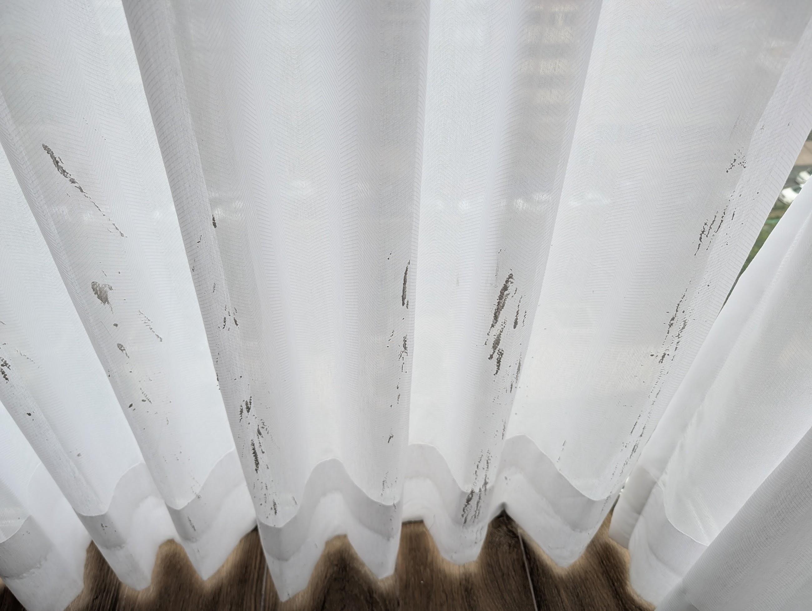 Curtain with paint stain