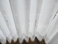 Curtain with paint stain