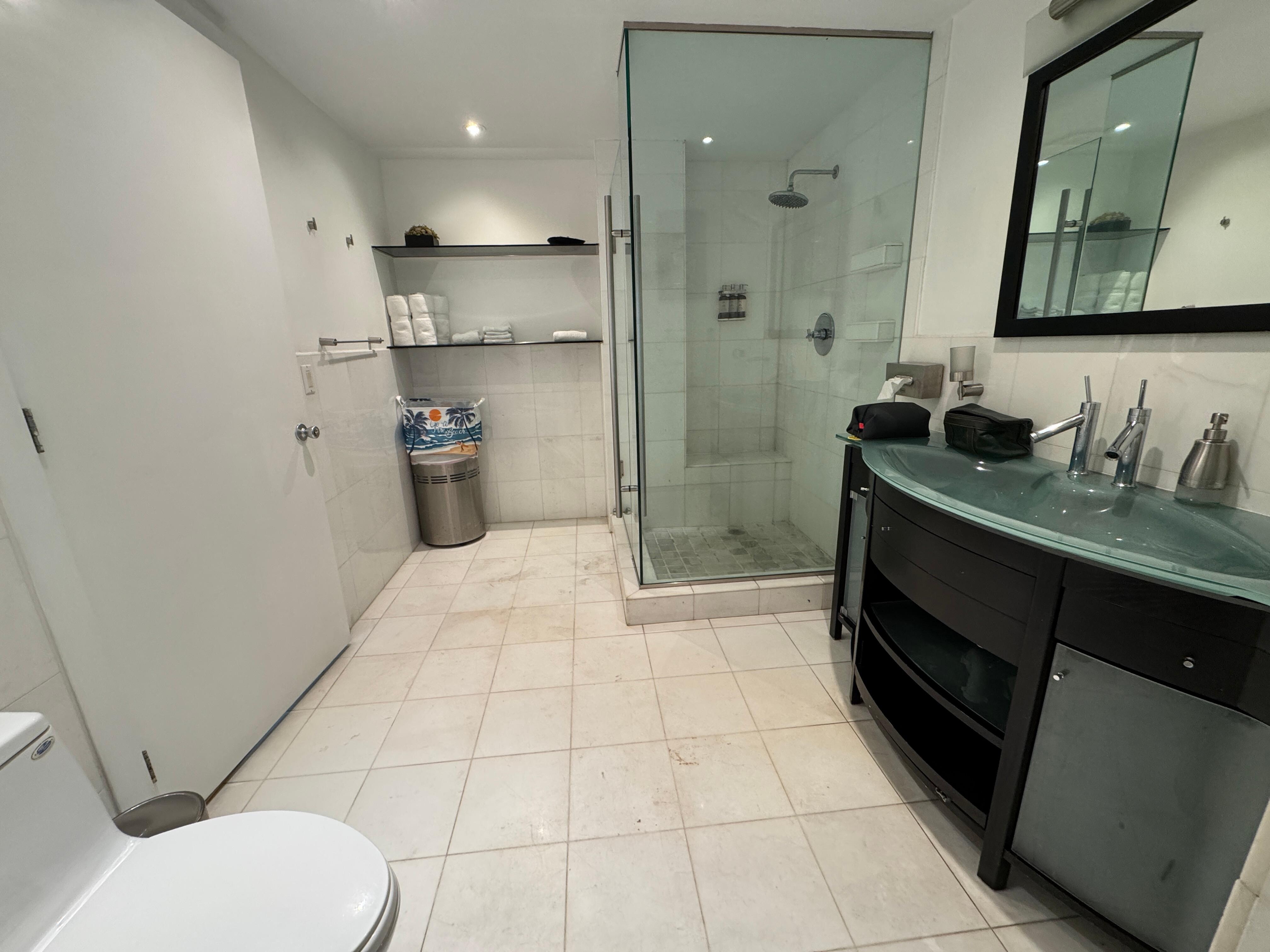 Spacious 2-way bathroom. Door to bedroom and door to living space.