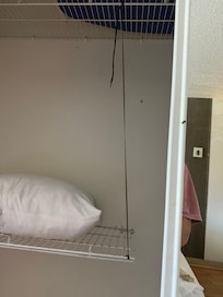 shelf held up by shoe lace