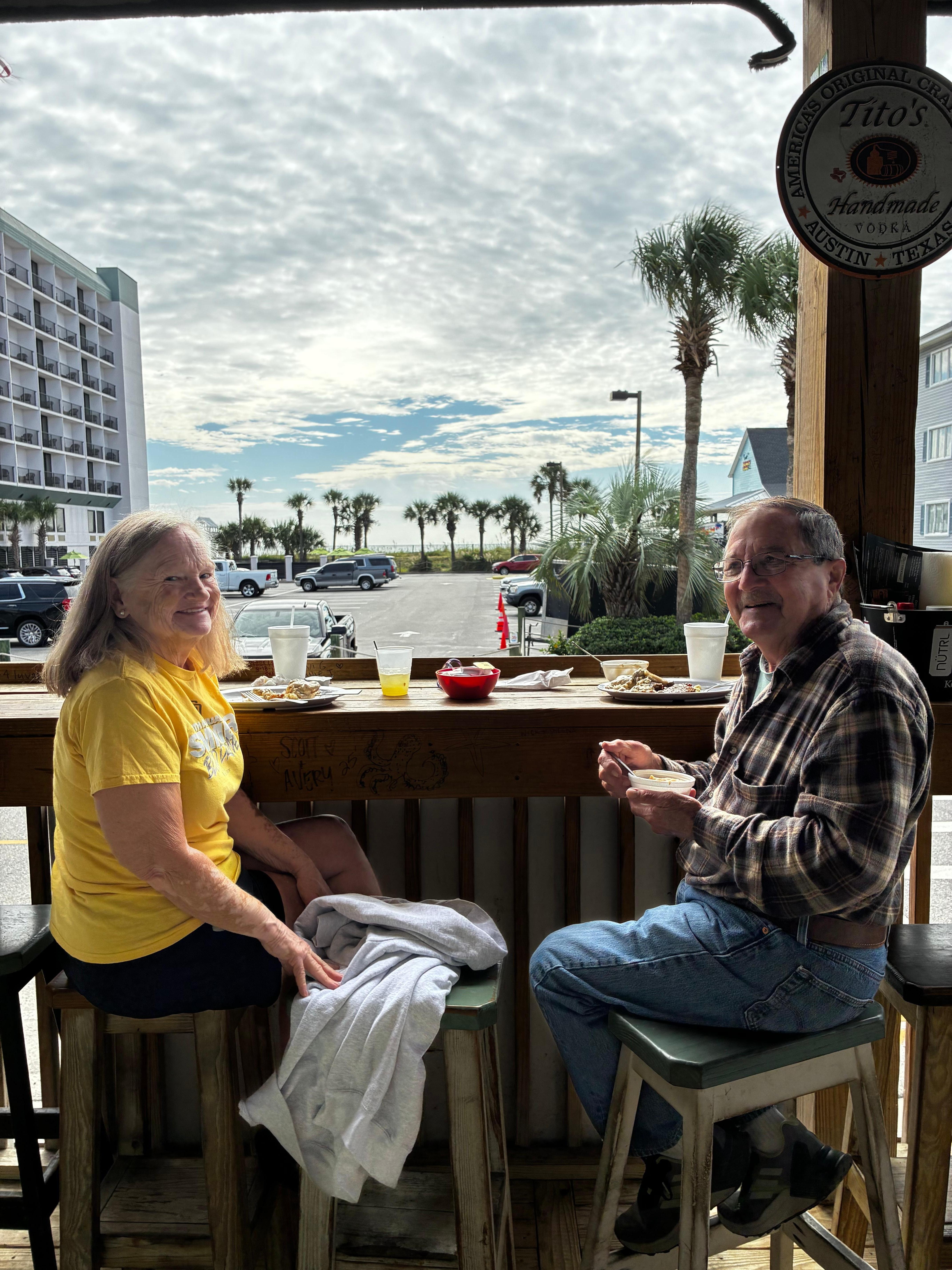 Enjoying breakfast and a morning cocktail across the street at Neal and Pam’s. 