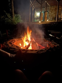 Outdoor campfire - wood is stocked and supplied.