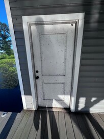 Door to boat house needs power washed