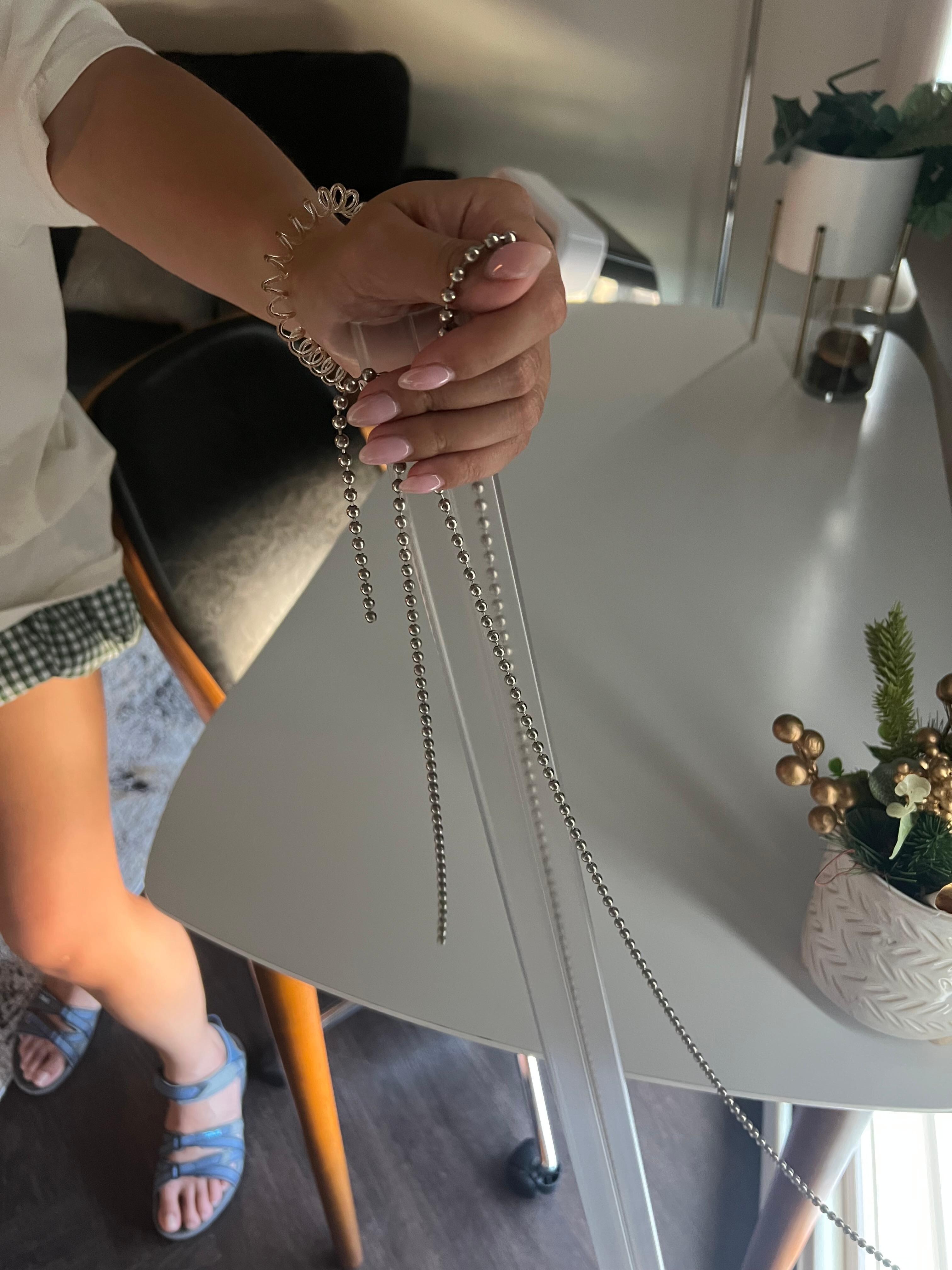 Broken chain from window covering