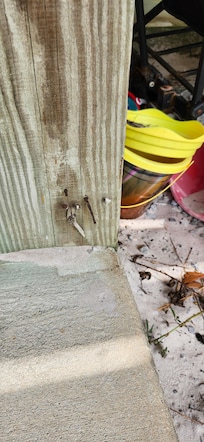 Rusted nails next to kids toys for sand play