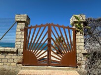 Gate of property looking out to sea
