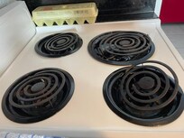 Dirty stove top. Hotplate elements broken and disconnected.