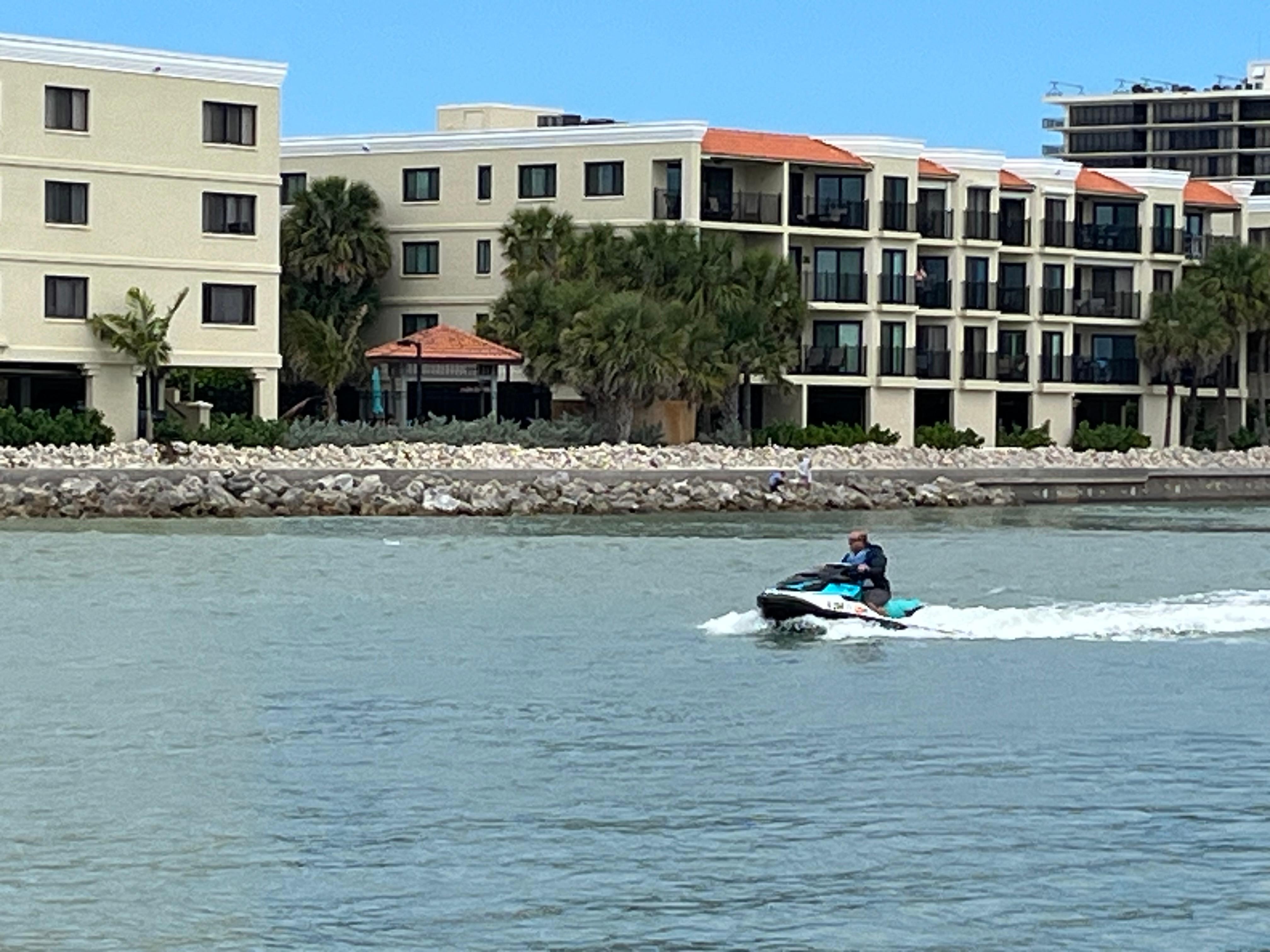 3 houses away watching boats and jet ski activity