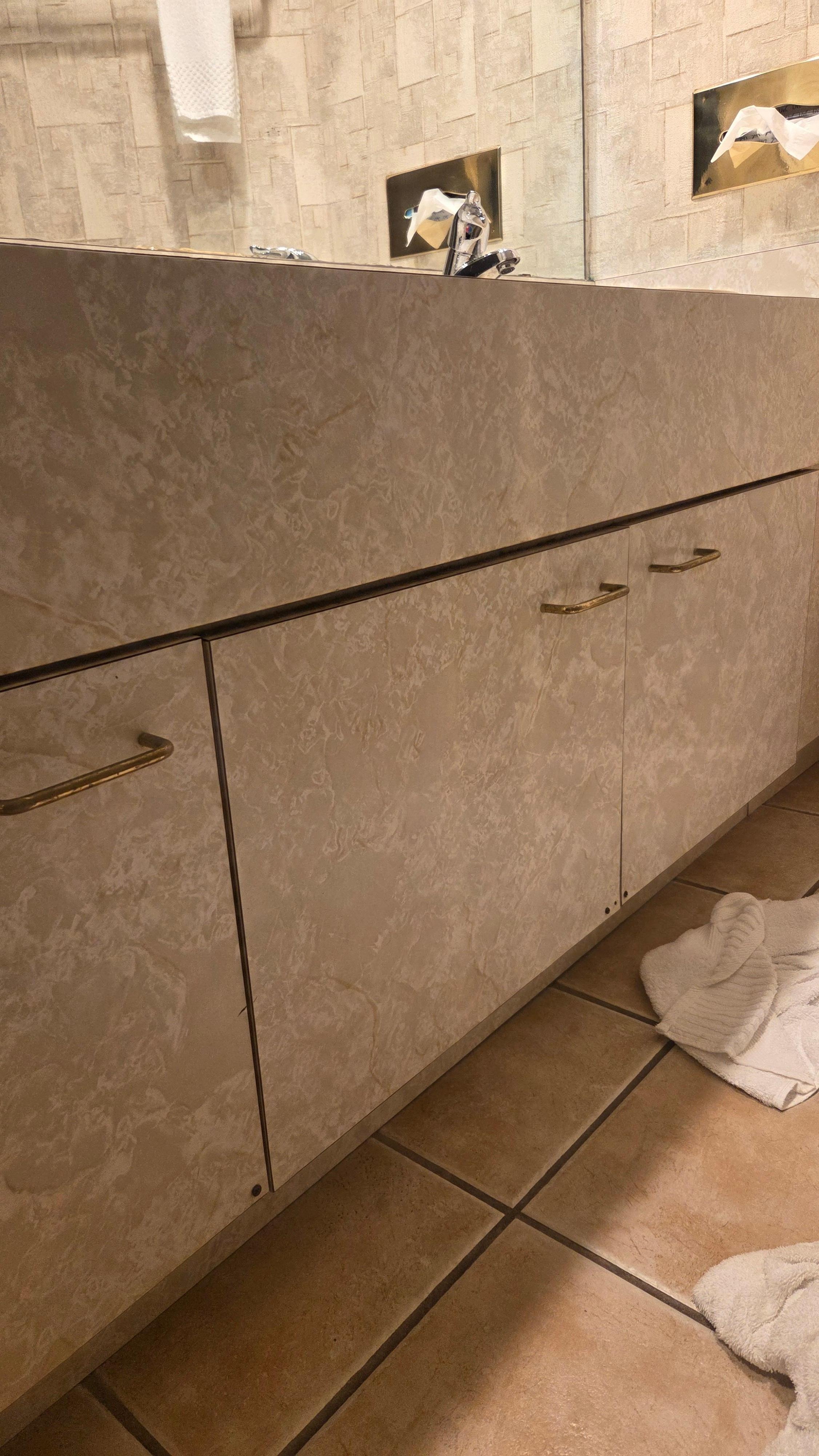 Drywall screws through bathroom vanity