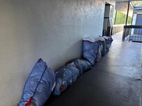 Dirty laundry stacked along the room corridor