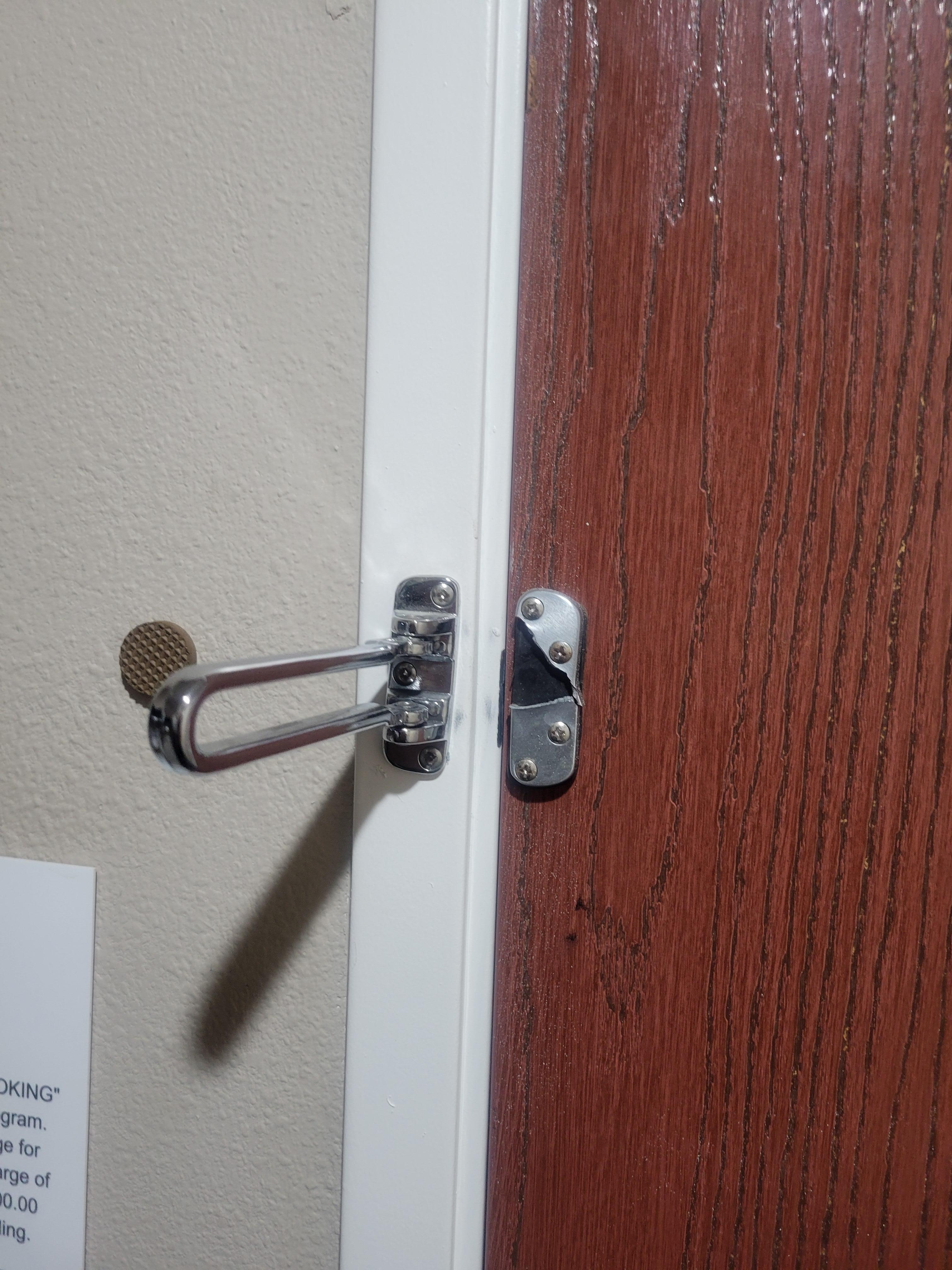 Busted door security latch on door that required full force shpulder push to open and close