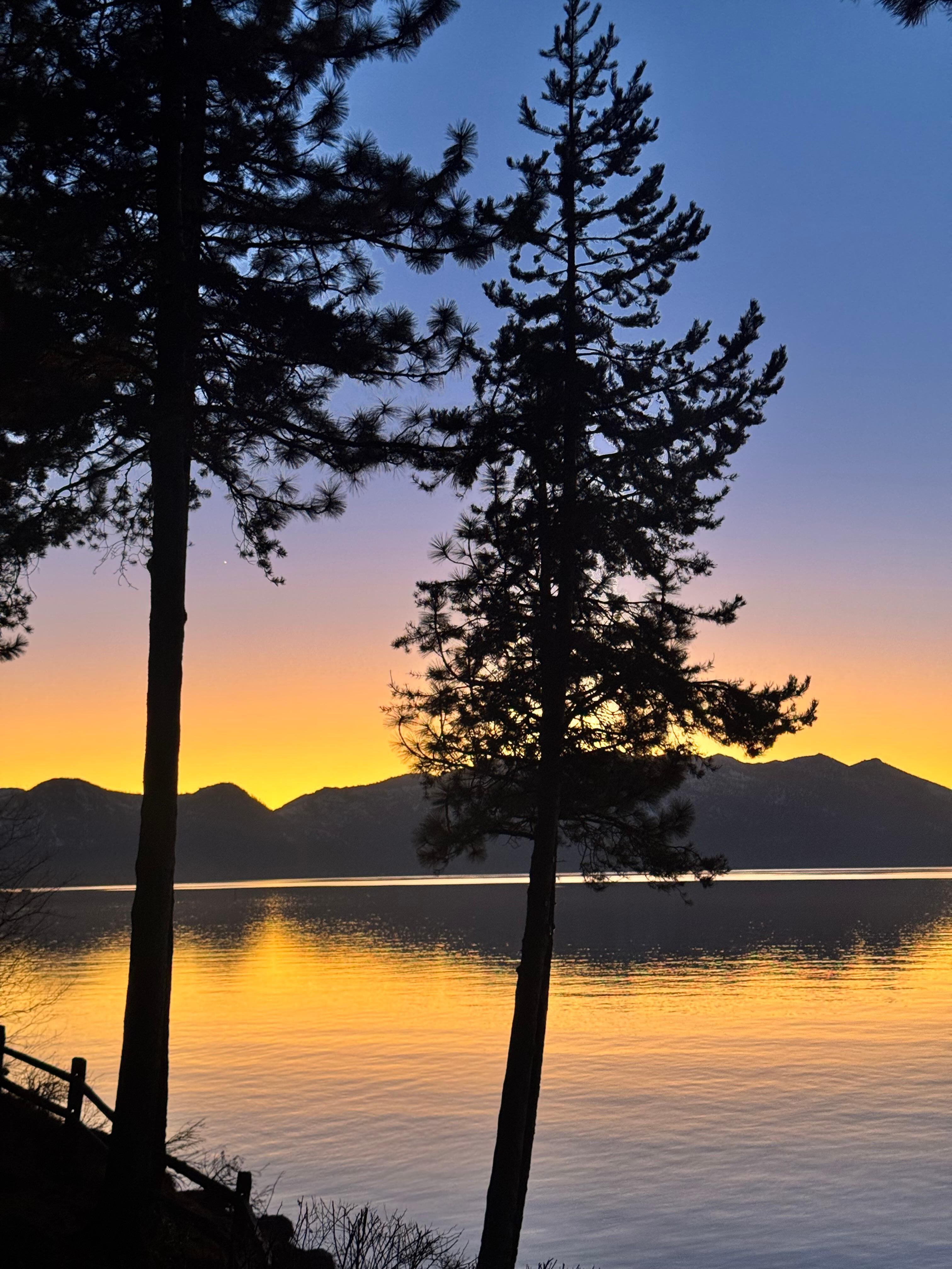 View of the lake at sunset from back of house