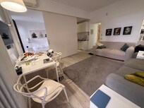 The sliding room divider means either the kitchen or the bedroom can be open, but you can't quite have both fully open simultaneously.