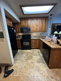Small kitchen with inconvenient sink