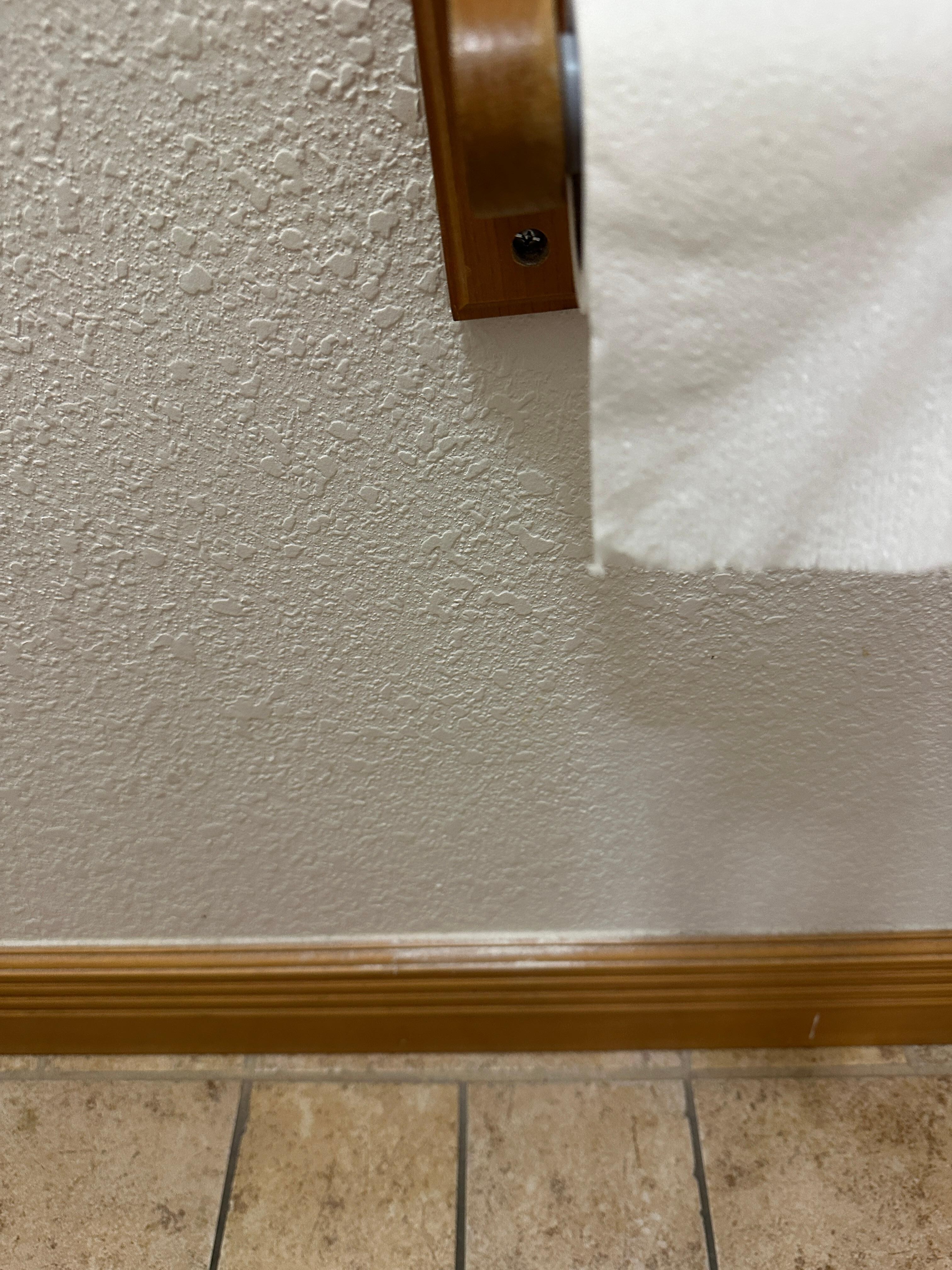 Sheet rock dust on bathroom baseboards.