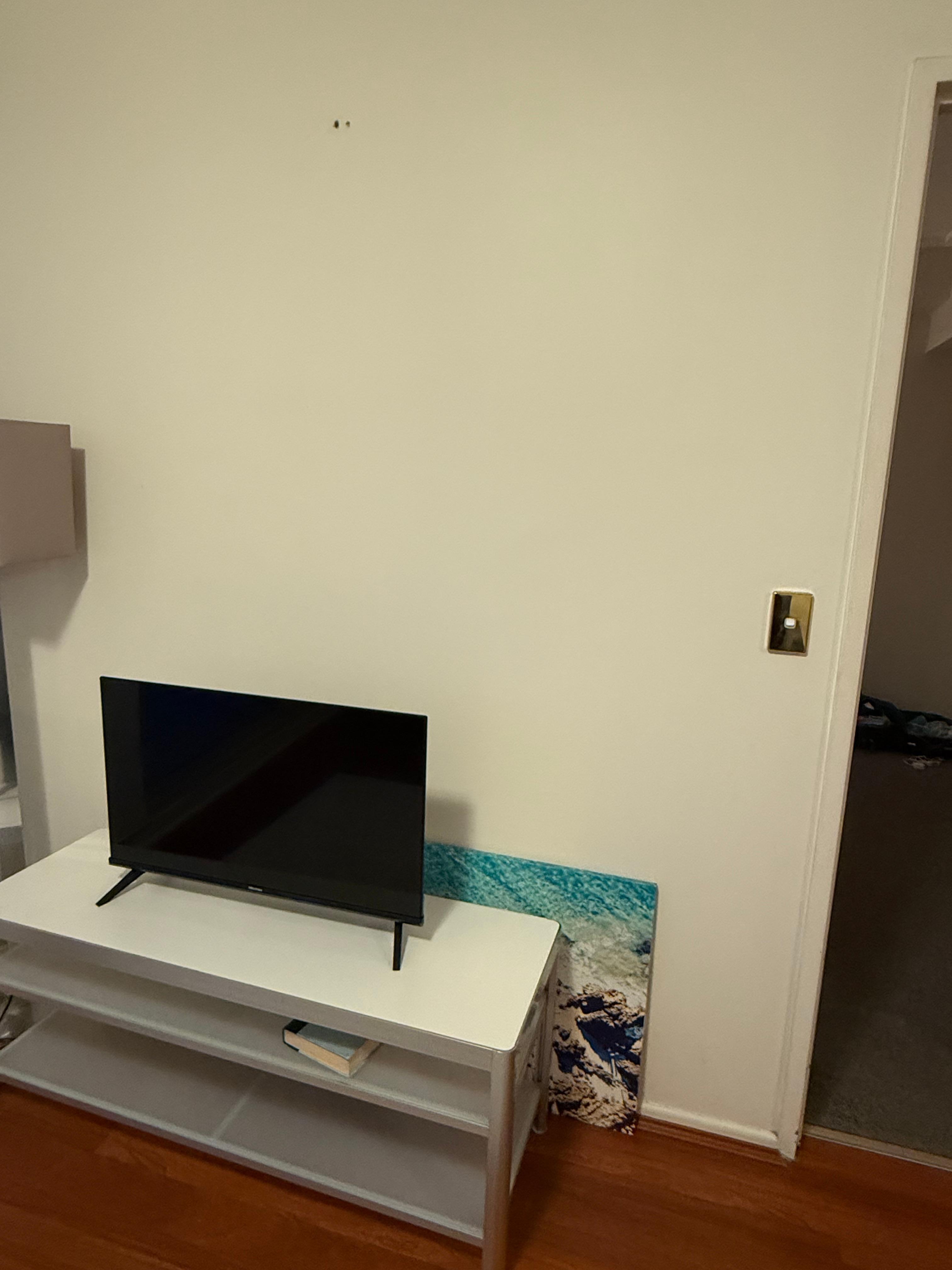 Painting off the wall and small TV