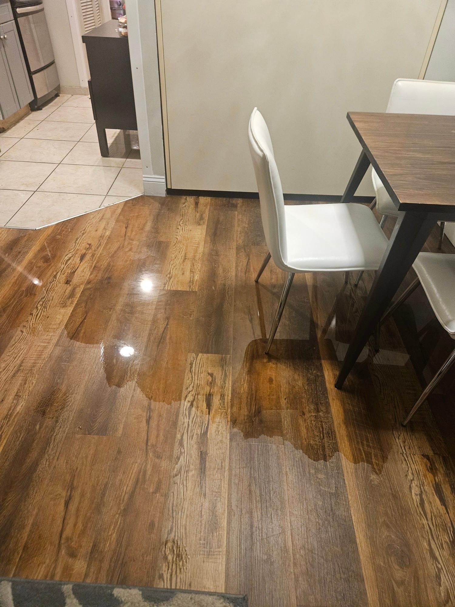 Flooded floor caused by the sink.