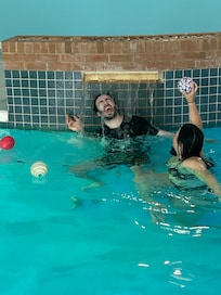 Grown up son and girlfriend enjoying the pool