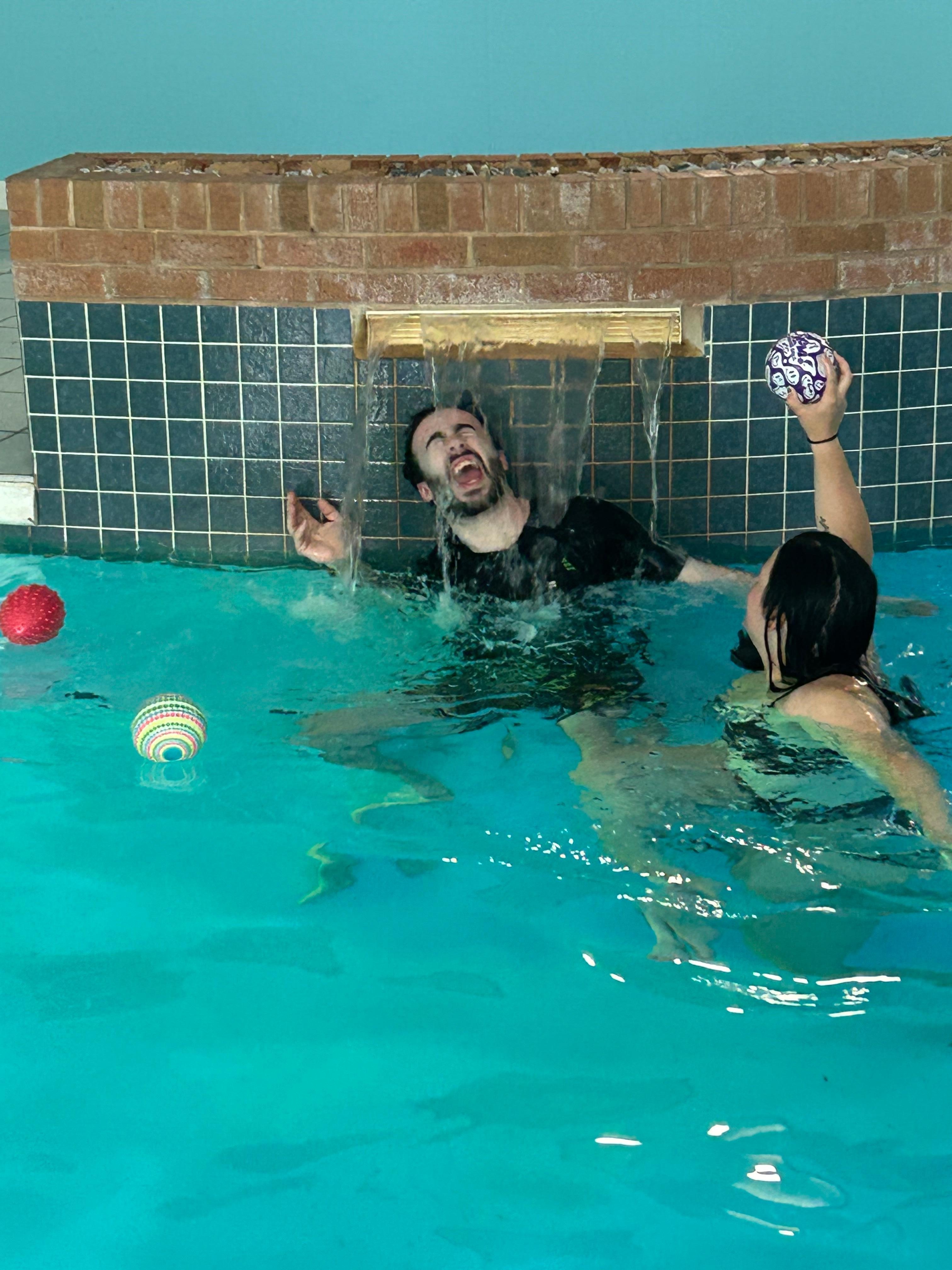 Grown up son and girlfriend enjoying the pool