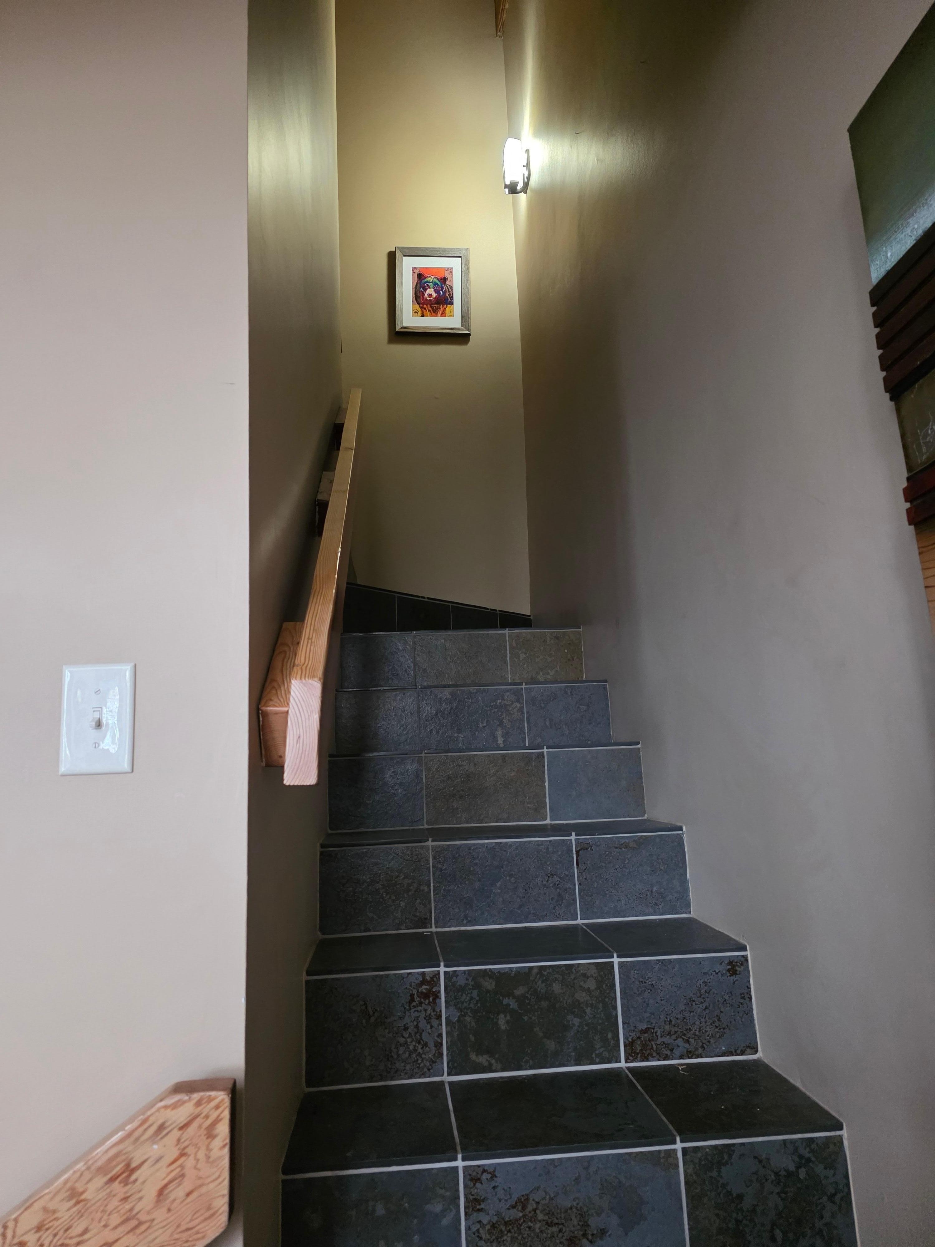 Stairway to loft and ladder. 