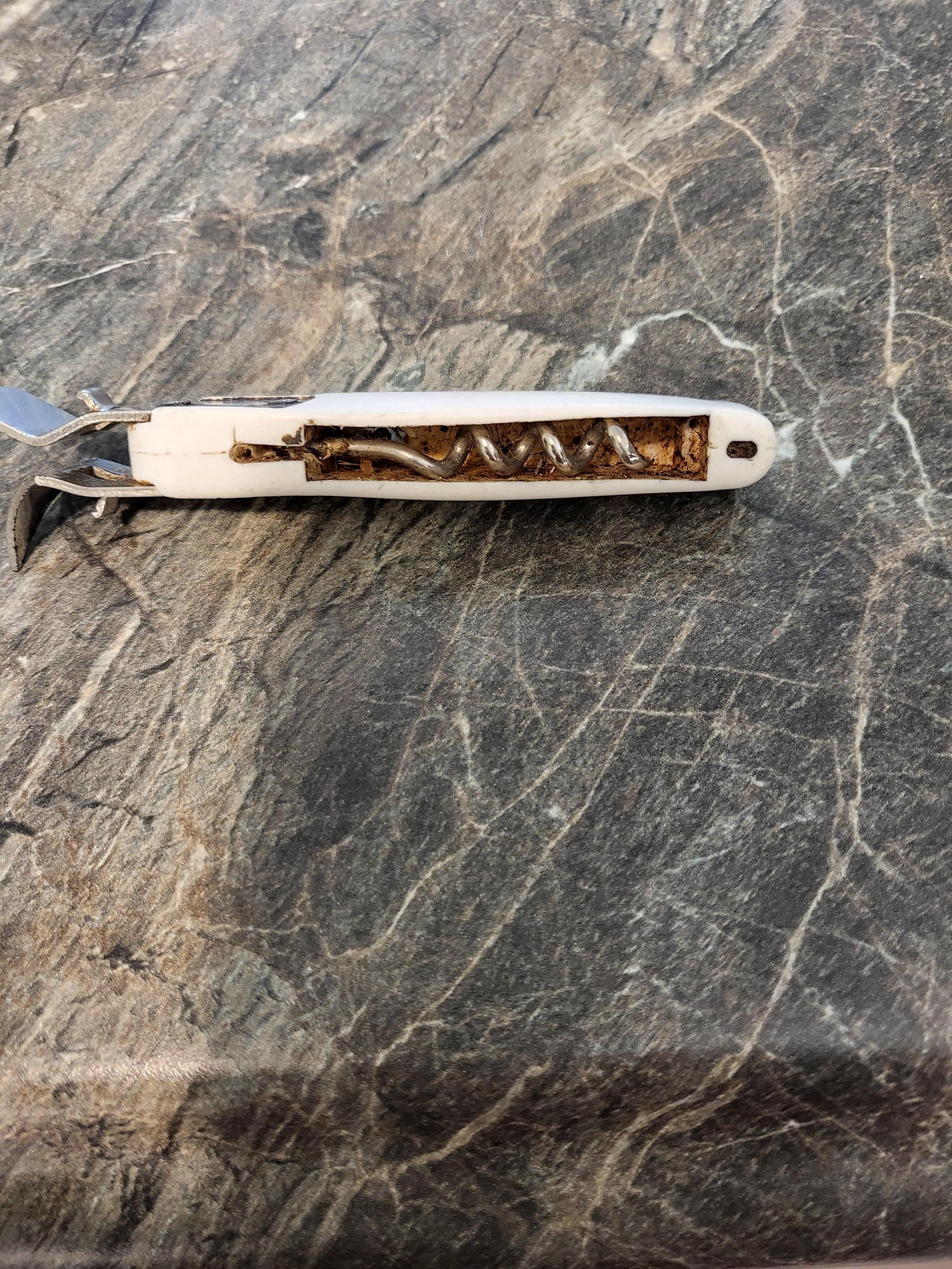 This was the can opener in the silverware drawer.