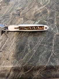 This was the can opener in the silverware drawer.