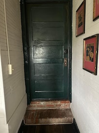 Inside the front door - love the exposed brickwork.