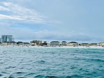 A view of the private beach access for Sandpiper Cove from our Seablaster Dolphin Cruise boat. So much fun to see so many dolphins!