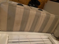 One cushion in kitchen window bench seat. Other one looks same.