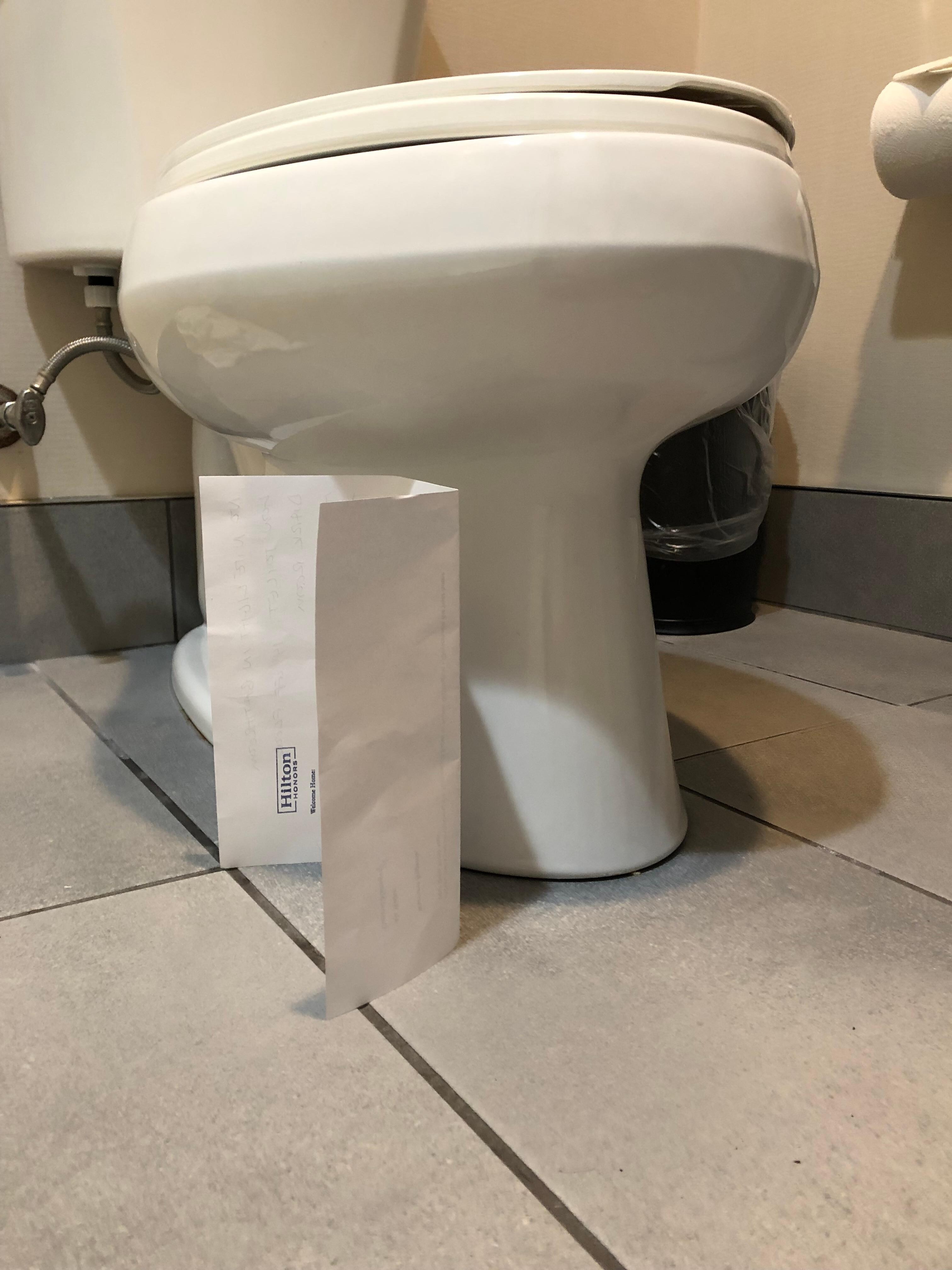 Paper is 8.5 inches, toilet is only about 13inches high
