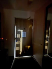 Door is closed but there are gaps all around so you can hear everything outside the room.