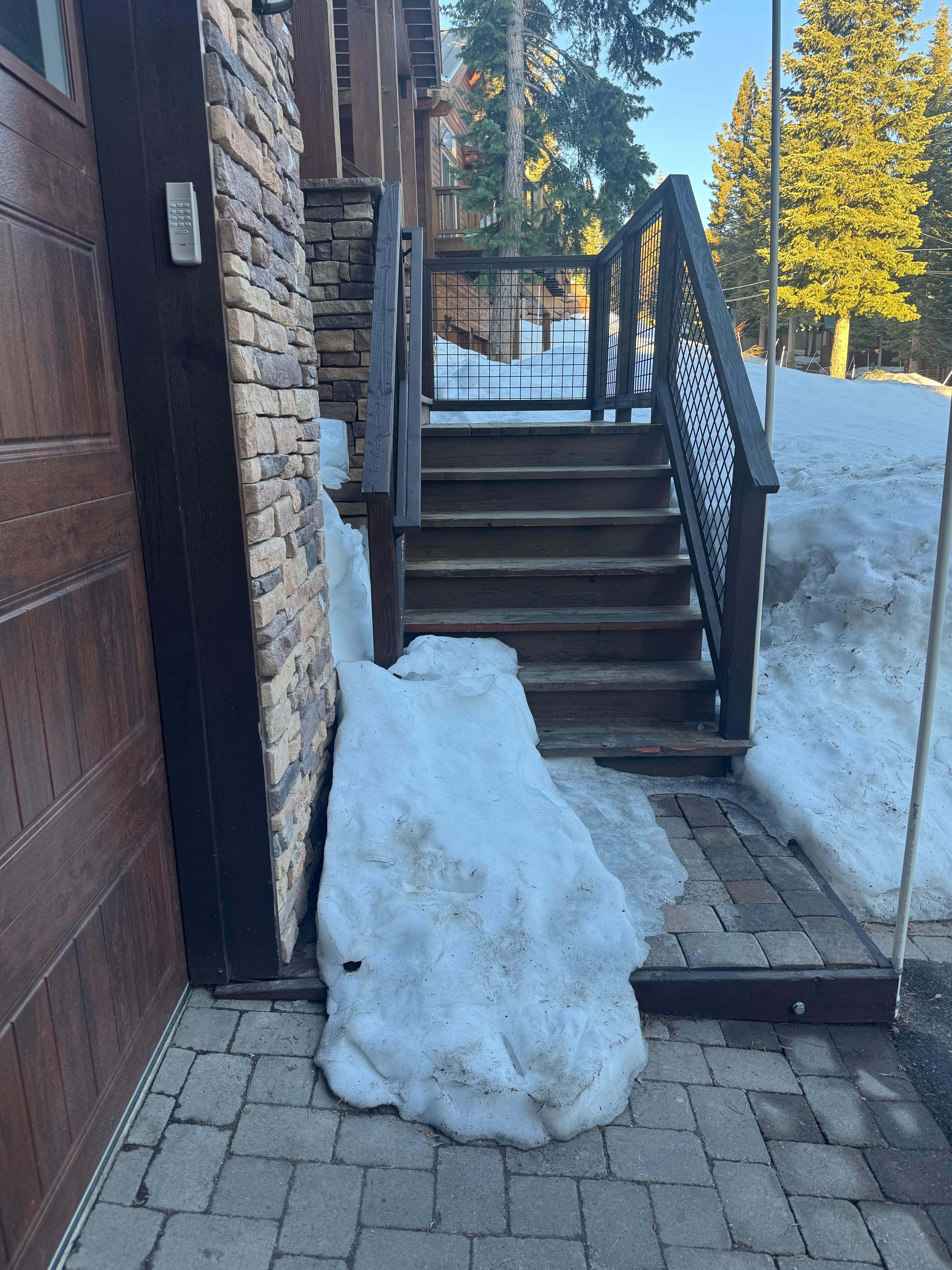 Front door entry steps ice and snow cover 