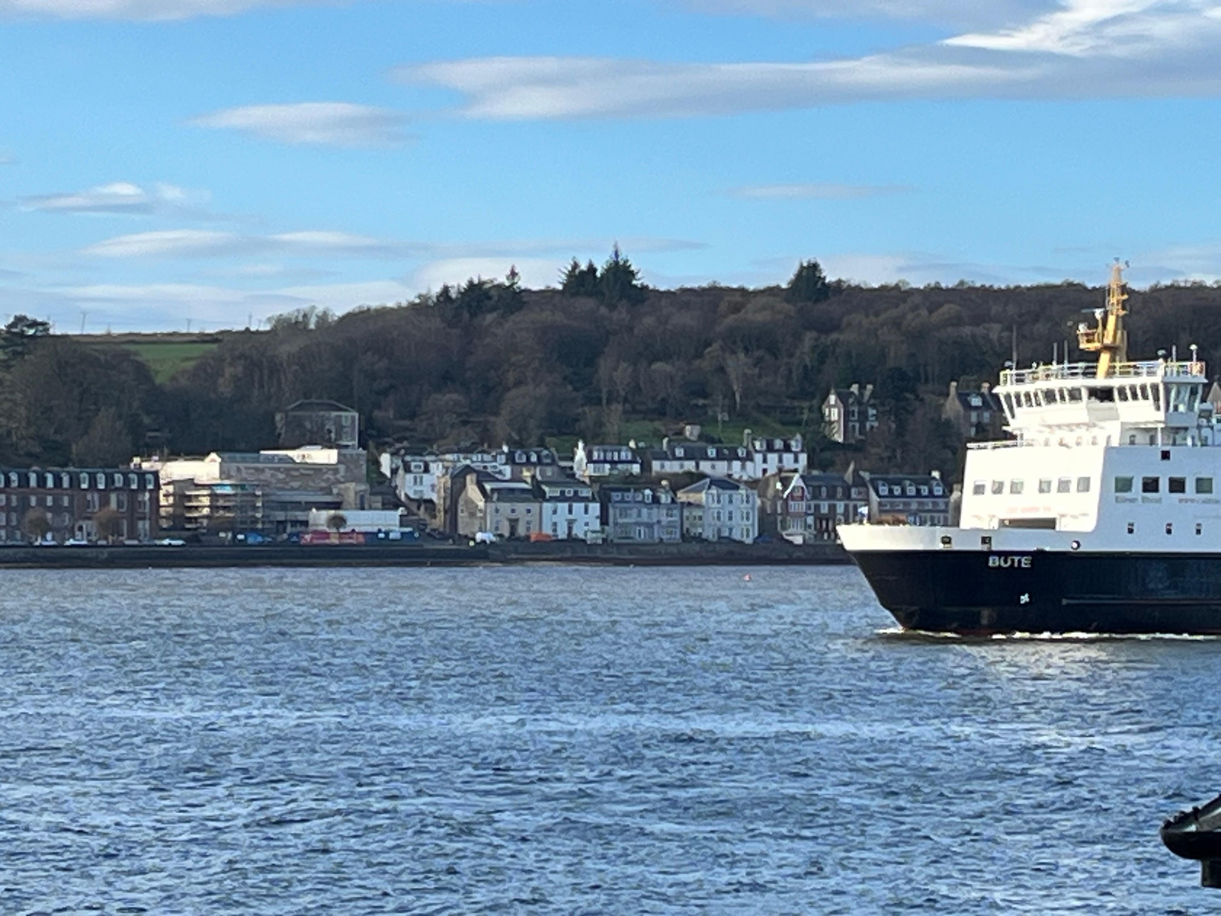 The flat is in the distance just ahead of the bite of the ship. 