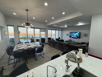 Large table and couch off kitchen.