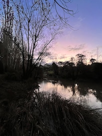 River view at sunset - photo taken at the end of the back yard