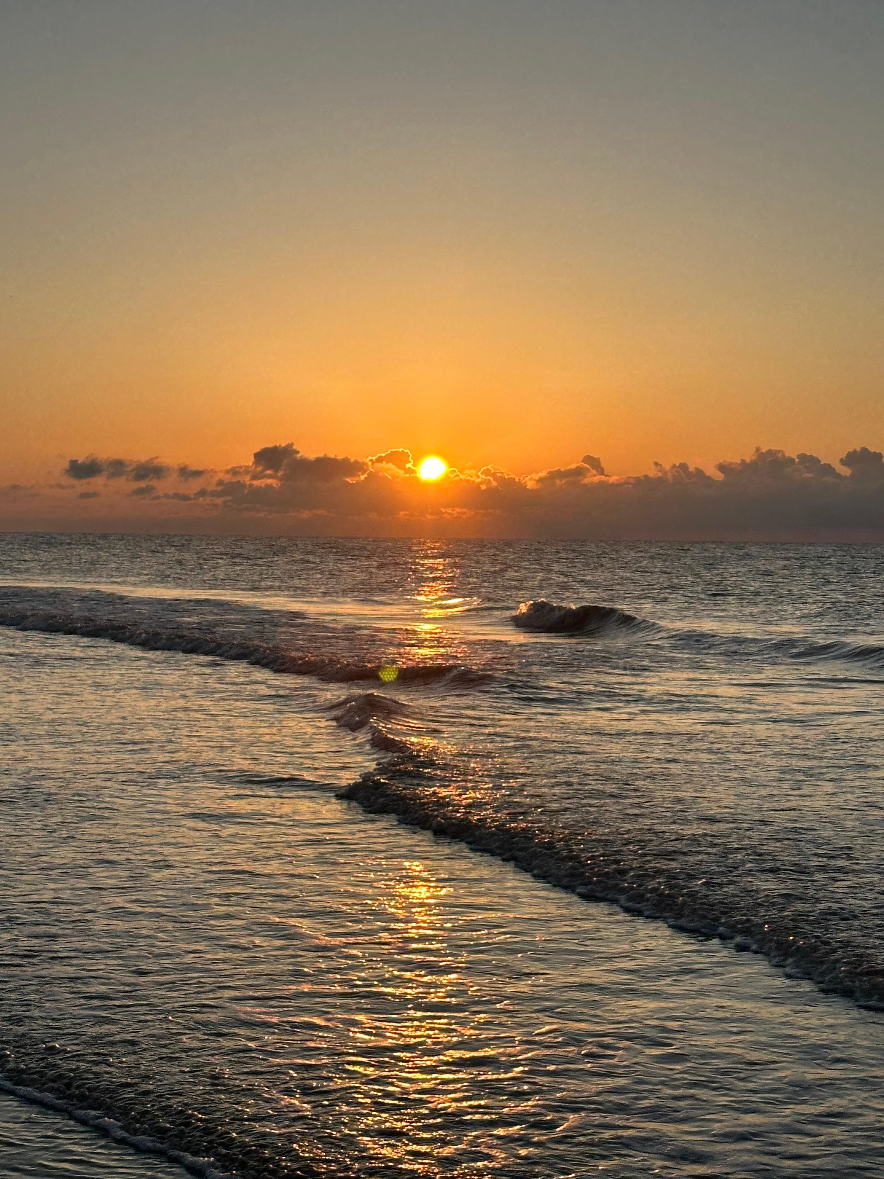 Beautiful sunrise viewed from the beach outside the Condo! 