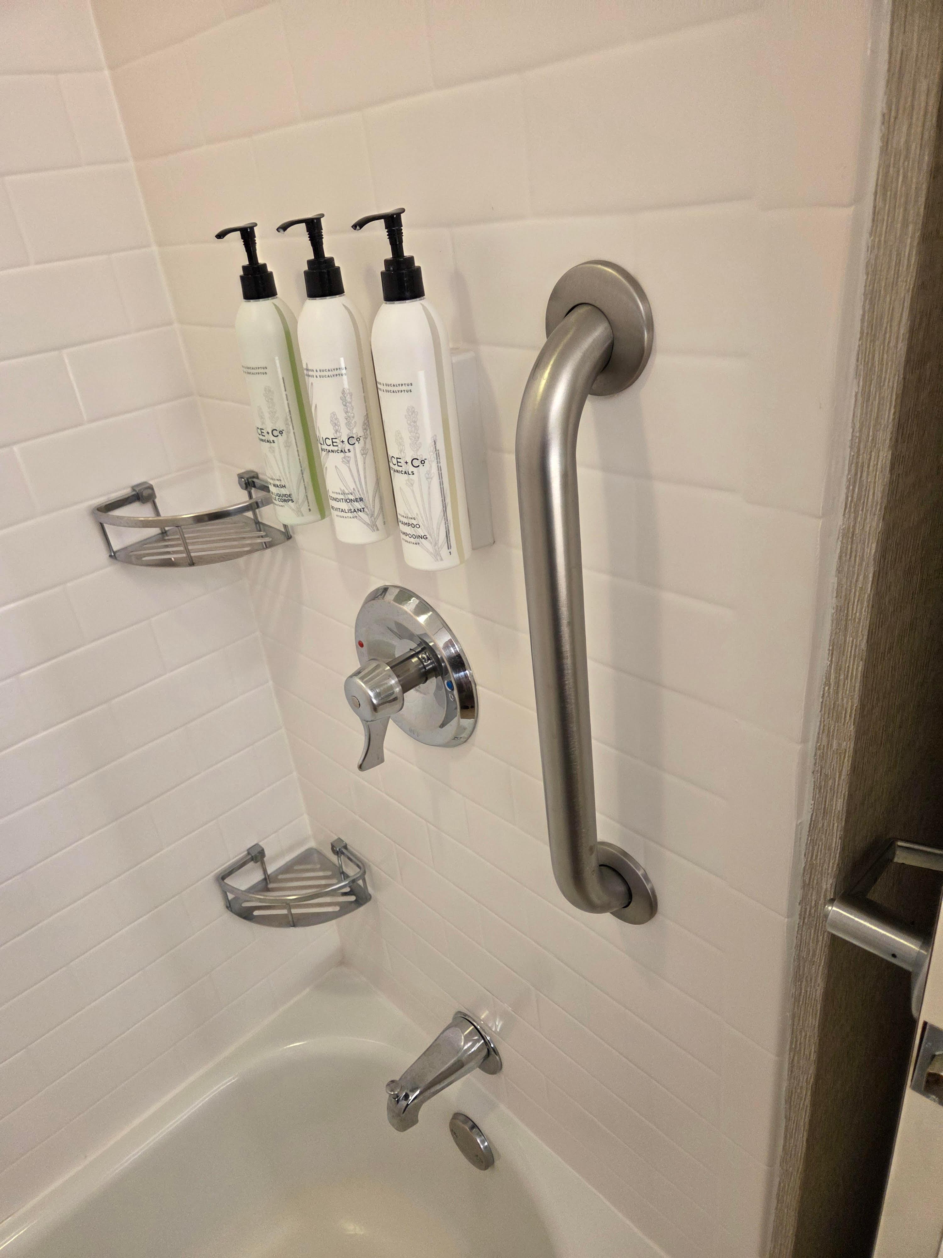 Clean, bright, well equipped bath with A GRAB BAR