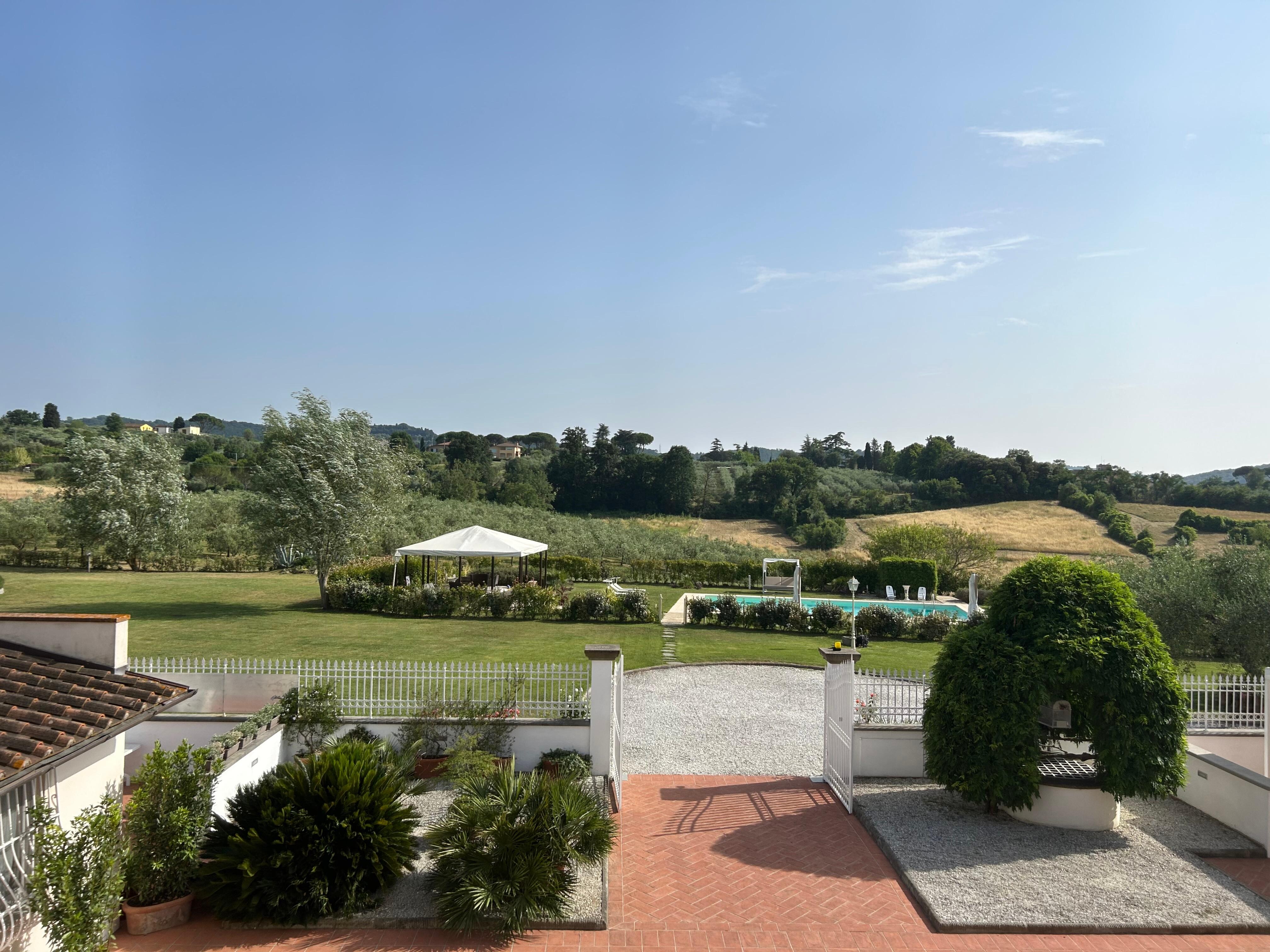 Pool and yard from villa