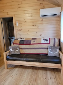 A place to lounge, or if necessary, folds into a bed