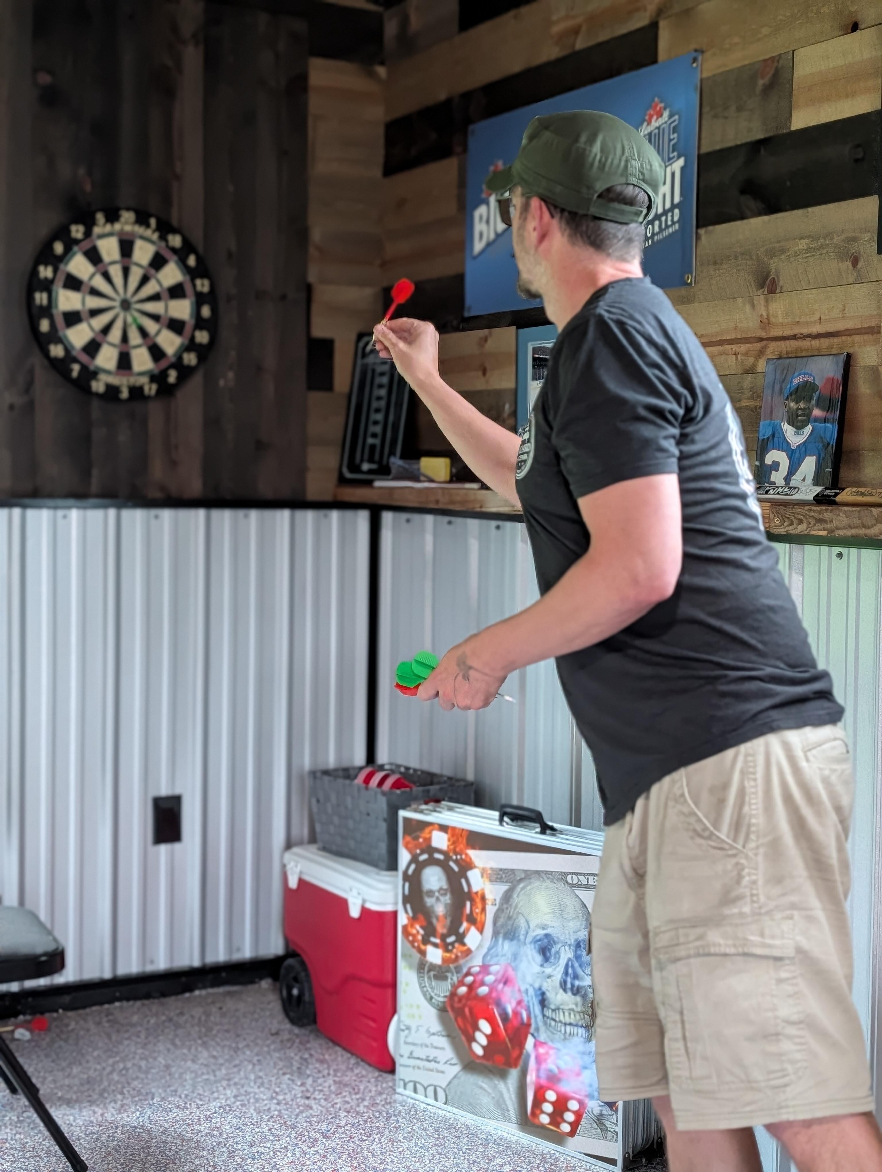 Hubby playing darts