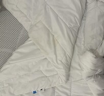 Stained duvet for sleeper sofa with no duvet cover provided
