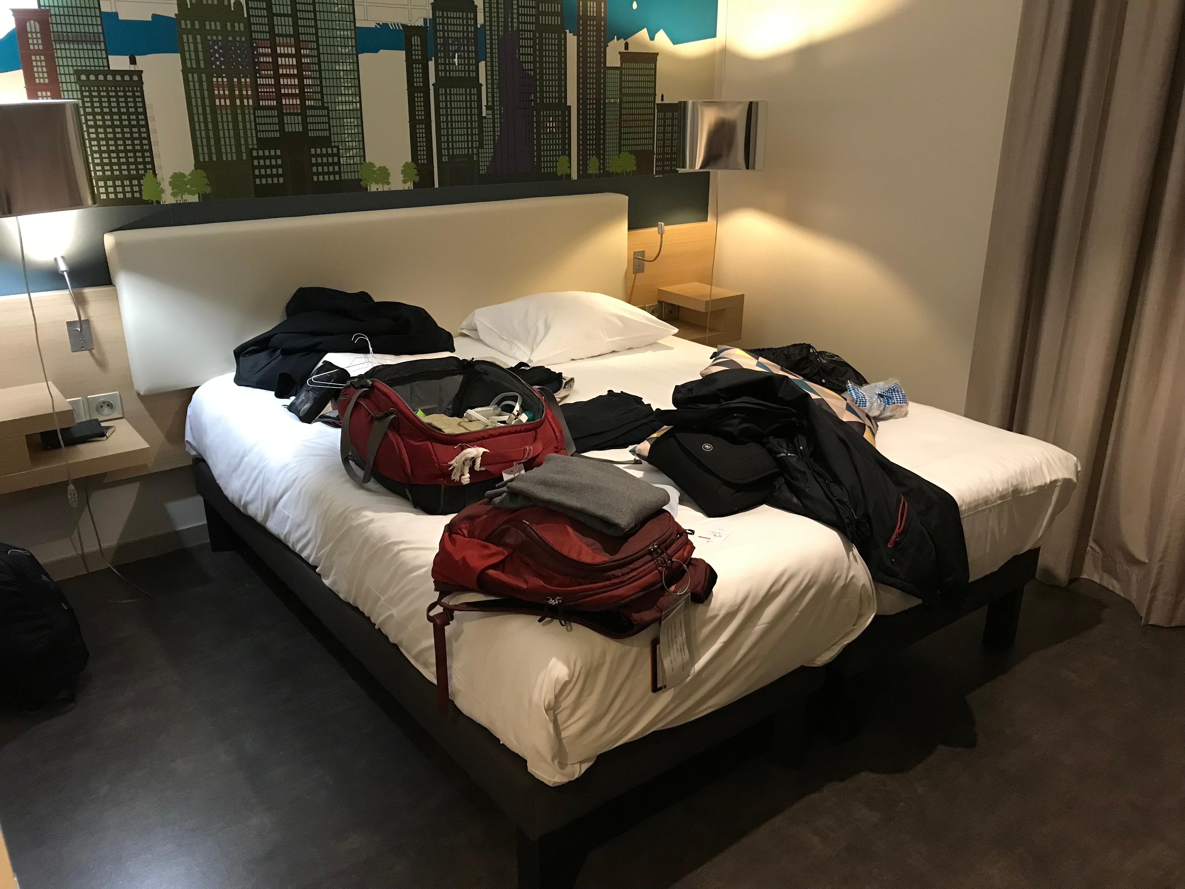 Bed with limited space around it.  That’s okay if it was just a bedroom.