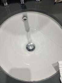Cracked hand basin which leaked underneath