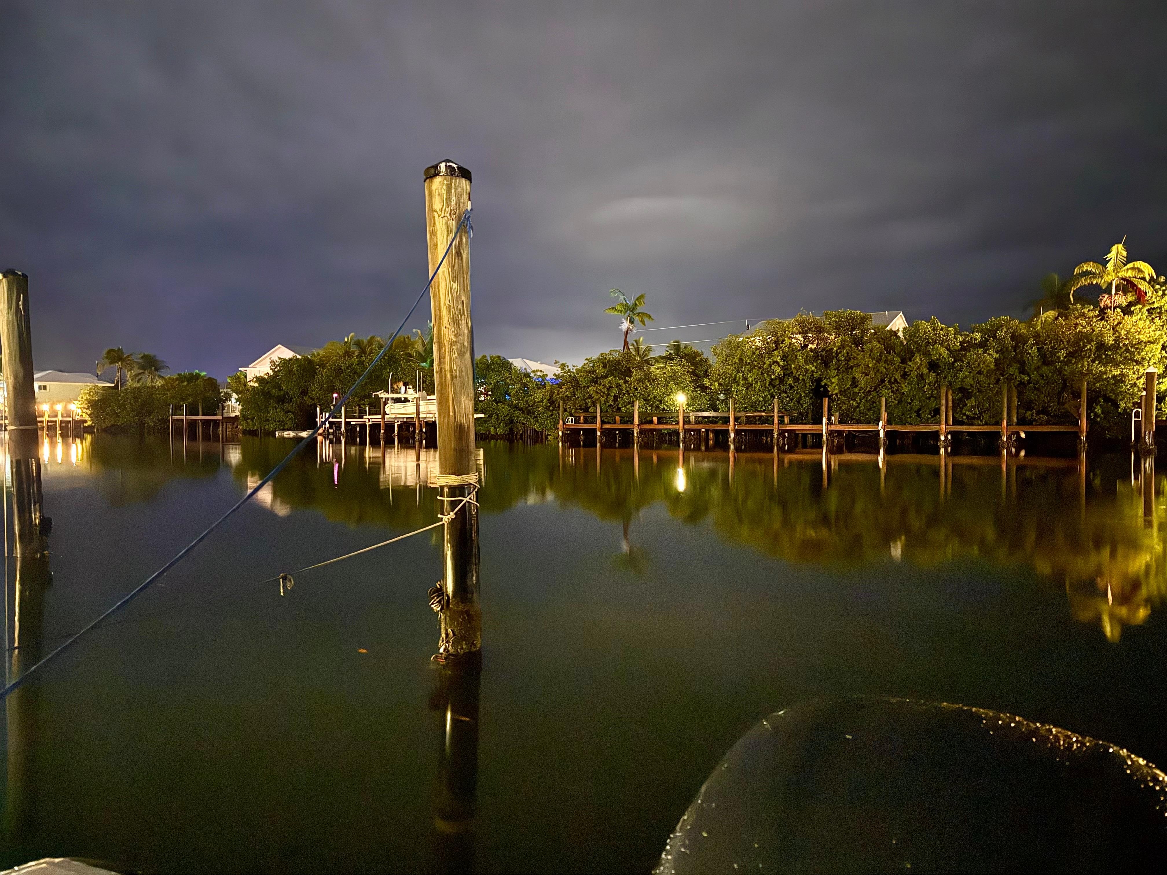 Night photo of the boat slip and canal. 